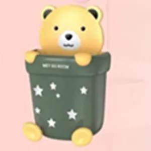 Detailed view of the cute yellow bear head design on the dark green storage cup