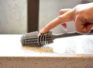 Close-up of flexible grey silicone bottle brush showing soft and durable bristles