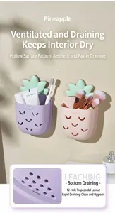 Detail view of pineapple wall-mounted bathroom organizers showing the bottom drainage holes
