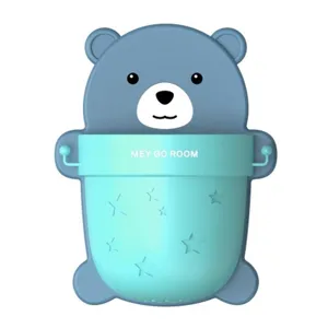 Detailed view of the cute blue bear wall-mounted storage cup and toothbrush holder.