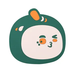 Close-up of a cute green dinosaur silicone heat-resistant placemat for dining tables