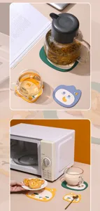 Set of cartoon animal shaped silicone heat resistant coasters shown in a kitchen setting