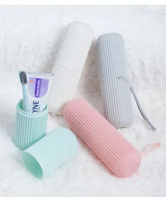 Detail view of portable travel wash cups featuring a striped texture and various toiletries