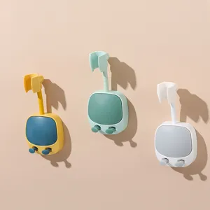 Adjustable bear-shaped shower head holders in three colors for wall-mounted bathroom storage.