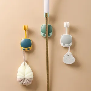 Detail view of retro TV-style wall-mounted shower head holders in three colors
