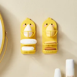 Detailed view of yellow duck-shaped wall-mounted makeup sponge and powder puff holder