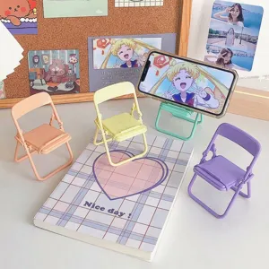 Cute macaron-colored mini folding chair phone stands for desktop display and support.