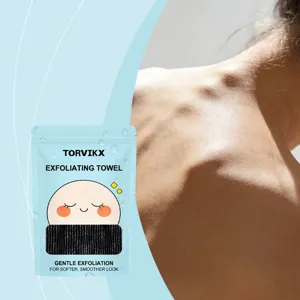 Close-up of TORVIKX exfoliating towel package with macro view of smooth skin detail.