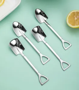 Detail shot of stainless steel shovel spoons with mirrored finish and unique shapes