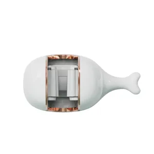 Close-up of whale-shaped wall-mounted mop holder showing the internal clamping mechanism