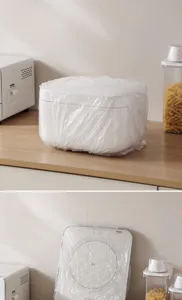 Macro view of disposable transparent dust cover protecting a white kitchen appliance