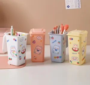 Four cute cartoon mini desktop trash can storage buckets in pastel colors with lids