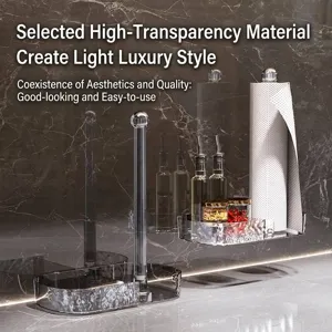 Transparent wall-mounted kitchen paper towel holder with storage tray on marble background