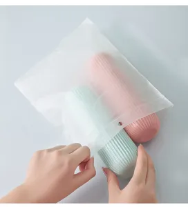 Close-up detail of portable striped travel wash cups inside a frosted plastic storage bag