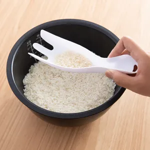 White multifunctional rice washer scoop and drainer tool for efficient kitchen use.