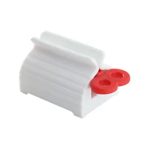 Manual plastic toothpaste squeezer roller for facial cleanser with red handle