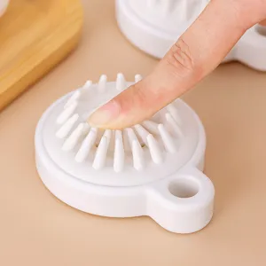 White silicone scalp massage brush for hair washing with soft bristles for head massage