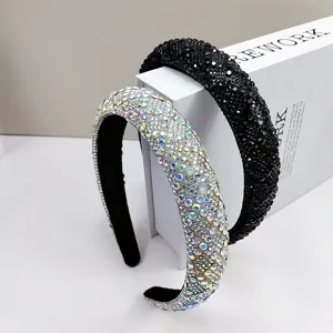 Close-up detail of luxurious sparkling iridescent and black rhinestone headbands for women