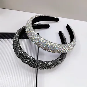 Detailed close-up of sparkly rhinestone-encrusted headbands in black and iridescent colors