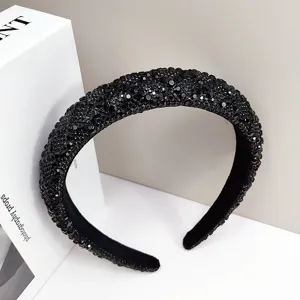 Detailed macro shot of luxury black crystal padded headband with sparkling rhinestone decor