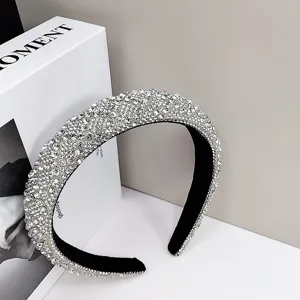 Close-up detail of a luxury rhinestone-encrusted headband designed for elegant party wear