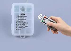 Détail du boîtier de commande à piles et de la télécommande pour guirlande étoile LED
