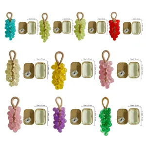 Handmade grape-shaped soap series in various colors with kraft gift box packaging