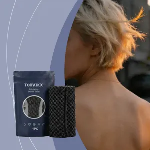 Close-up of Torvikx exfoliating shower towel with lifestyle skin exfoliation scene.