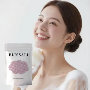 Close-up of exfoliating shower towel packaging with model using foam in background