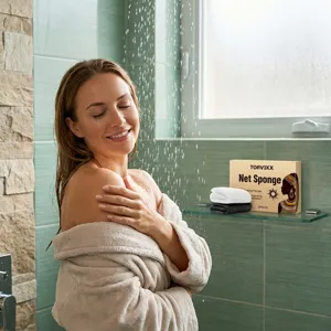 Lifestyle scene showing TORVIKX exfoliating net sponge set in a bright bathroom shower
