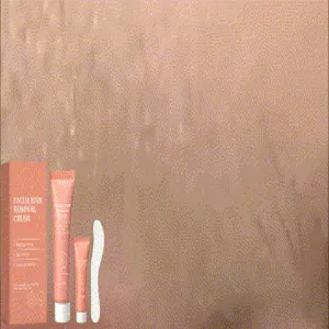 Macro view of facial hair removal cream set including tubes and a white spatula tool