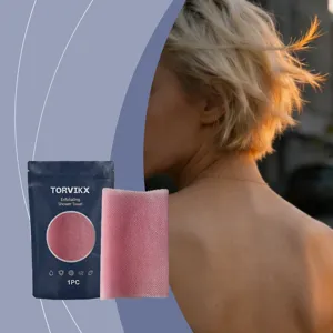 Pink exfoliating shower towel with Torvikx packaging showing soft skin texture details
