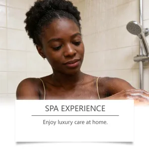 A woman using an exfoliating mesh sponge in the shower for a home spa experience.