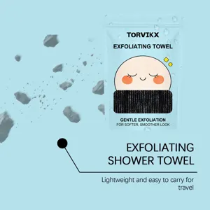 Detail view of TORVIKX exfoliating shower towel in portable light blue packaging