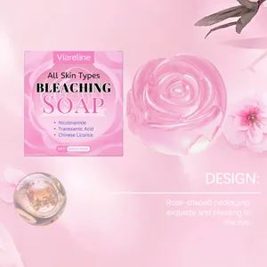Macro detail showing translucent rose-shaped soap and elegant pink floral packaging