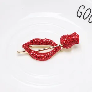 Detailed macro view of elegant red lips and rose brooch featuring red crystal rhinestones