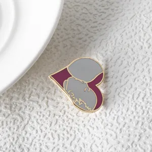 Detailed view of a burgundy heart breastfeeding enamel pin, Mother's Day jewelry gift.
