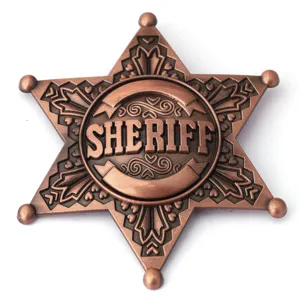 Macro view of a classic bronze six-point star sheriff badge with embossed sheriff text