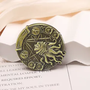 Close-up macro shot of vintage bronze Cthulhu Necronomicon sigil brooch pin jewelry