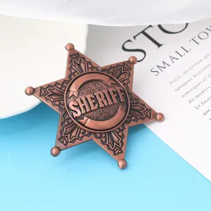 Detailed view of a vintage copper six-pointed sheriff star badge for party cosplay