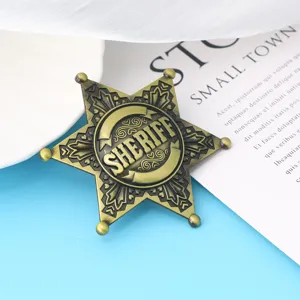 Close-up of a bronze vintage sheriff star badge with embossed SHERIFF text for cosplay.
