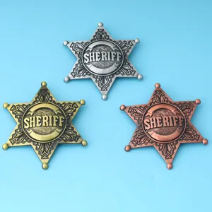 Vintage metal sheriff badges with six-pointed star design in gold silver and bronze