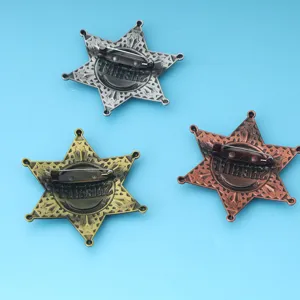 Vintage Sheriff star badge pins in three metallic finishes for costume parties.