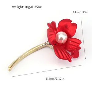 Detail of red rose flower brooch with pearl and rhinestones showing size and weight