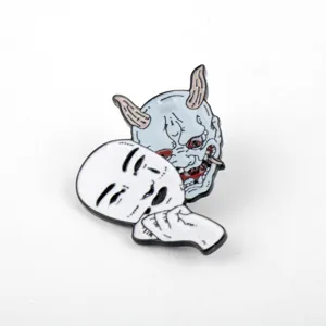 Detailed macro shot of Japanese Hannya mask and Noh mask enamel lapel pin design