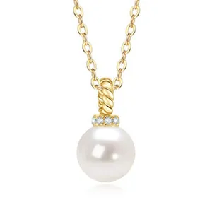 Close-up of minimalist freshwater pearl necklace with gold-plated silver pendant