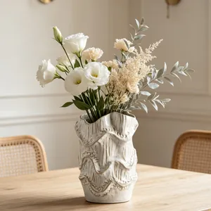 Close-up of creative vintage ceramic vase featuring unique artistic wavy texture for home decor