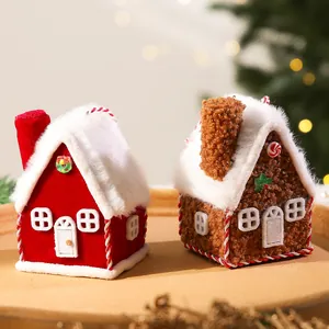 Detailed shot of plush Christmas house ornaments with soft fuzzy roofs and festive details