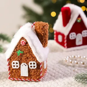 Cozy plush gingerbread house Christmas tree ornament with snowy roof and festive holly
