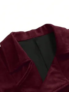 Close-up detail of burgundy faux suede men's business suit vest collar and black lining